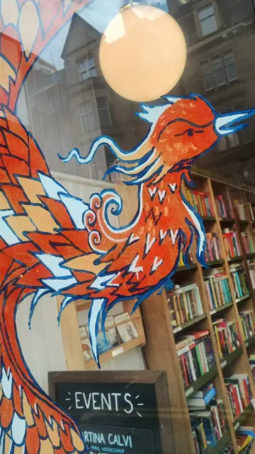 Close up of the colourful Phoenix painted on the Edinburgh Bookshop window