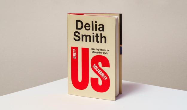 Us by Delia Smith photographed standing on a plain background.