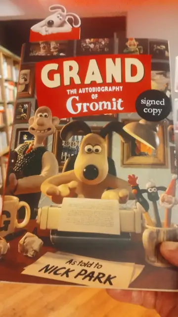 A "signed" hardback edition of Grand, the biography of Gromit, from the Wallace & Gromit animated films